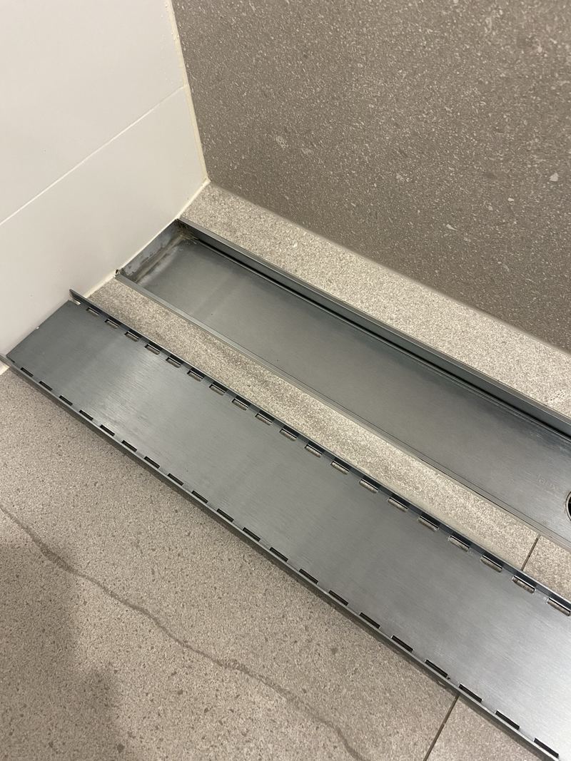 Shower drain channel clean and shining after cleaning