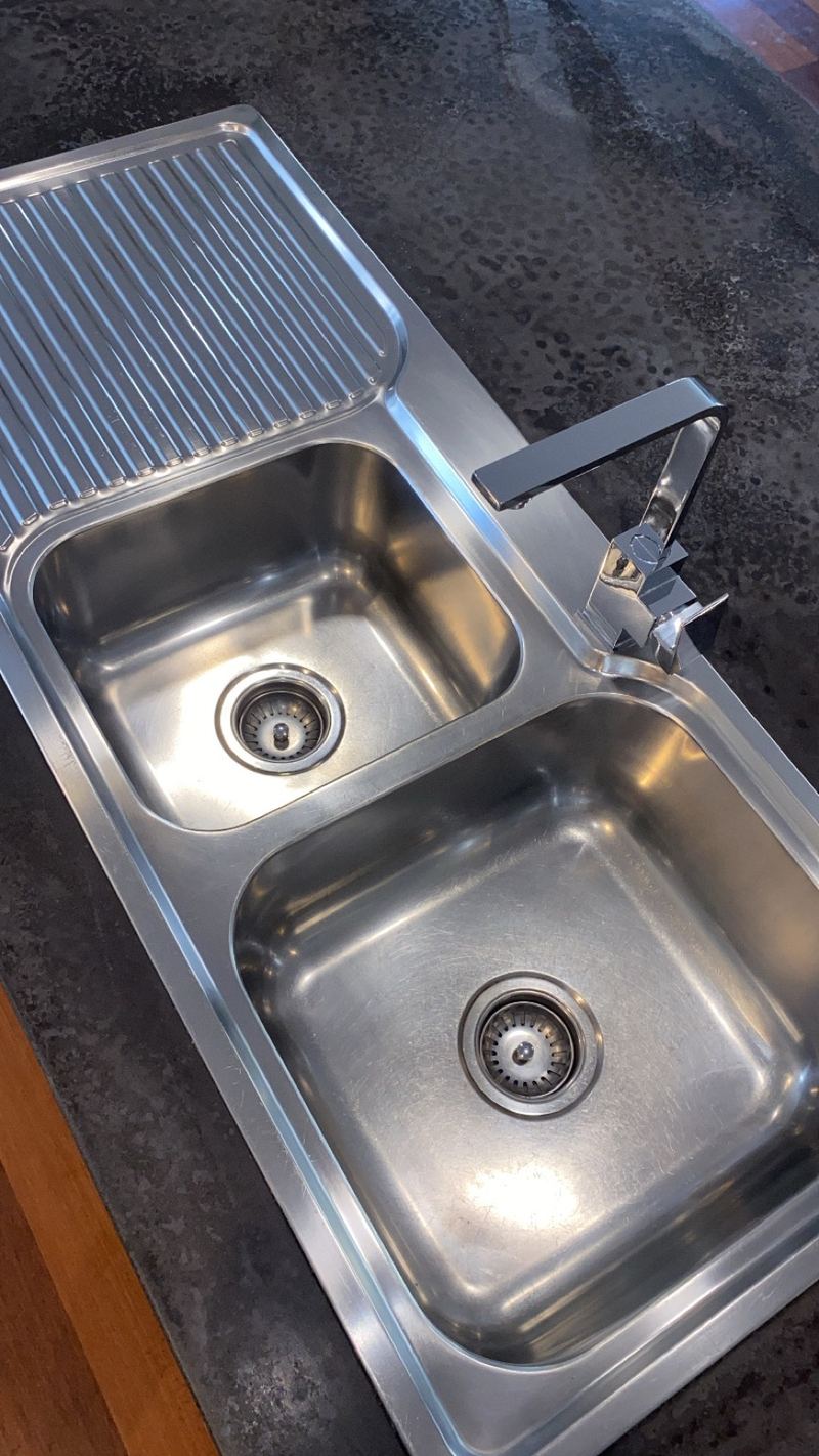 Stainless steel kitchen sink polished and spotless after an Aleka Cleans clean